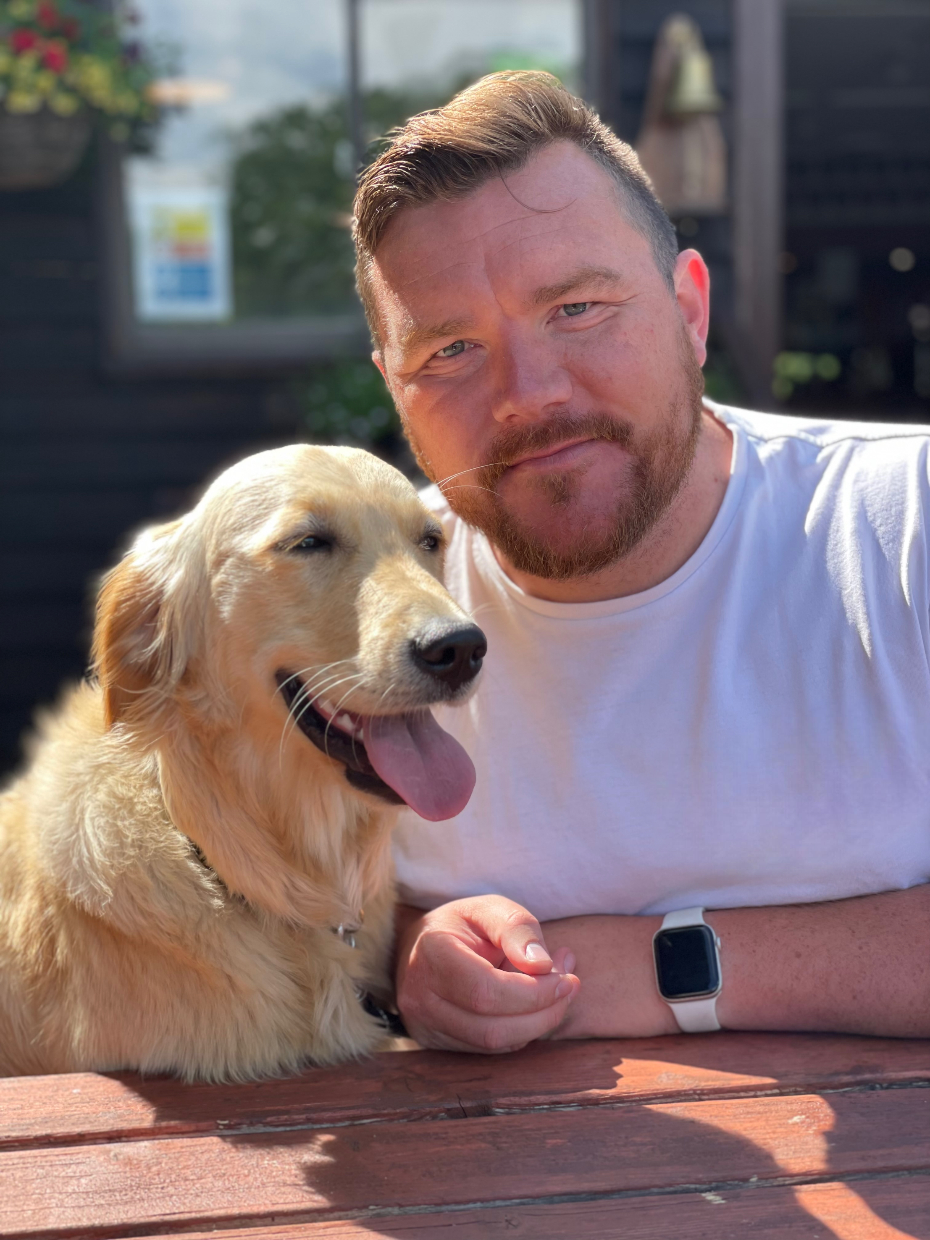 David, founder of Wild at Heart with his golden retriever